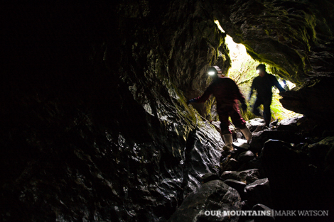 Neil and Paul enter the Nettlebed Cave lower entrance/exit from the Pearse Valley.