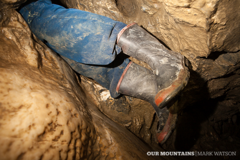 Prior to removing his gumboots, Paul gets wriggly with the first squeeze in the Hinklehorn Honking Holes, Nettlebed.